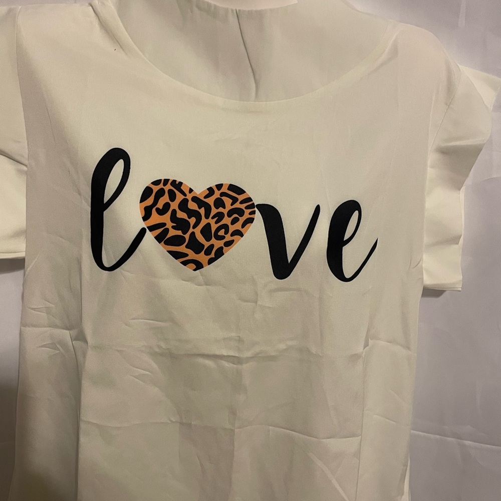 White shirt with the word love in black